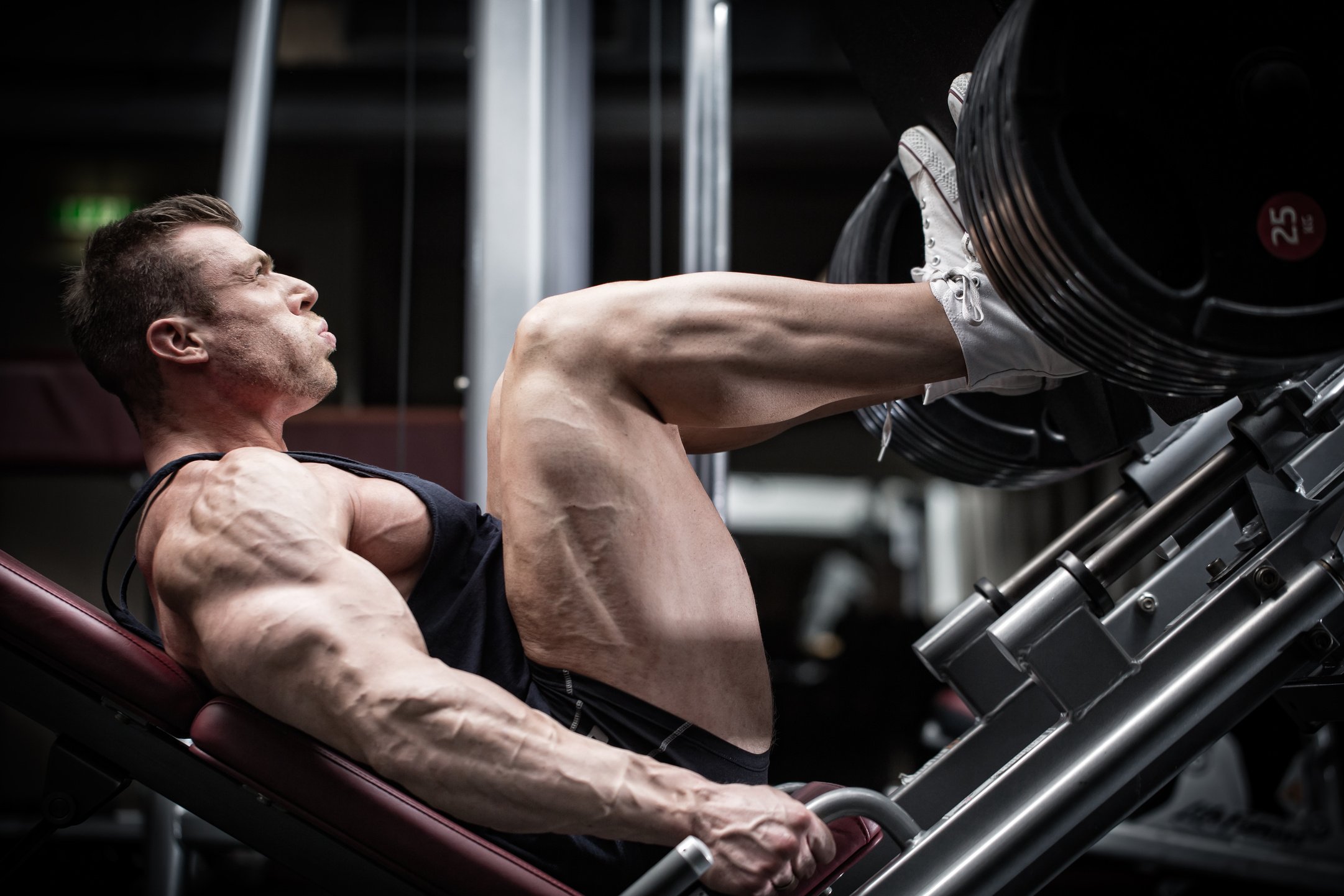 Man in Gym Training at Leg Press